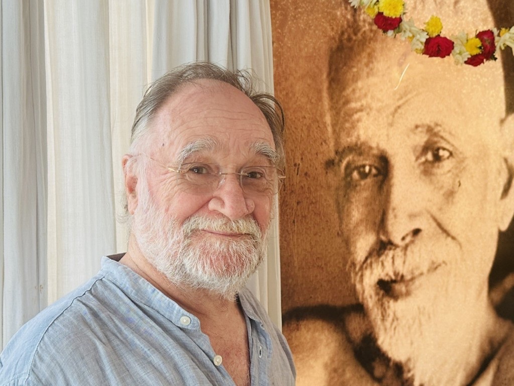 John David beside a portrait of Sri Ramana Maharshi